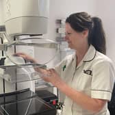 Trust radiographer Rachel Reed with the screening scanner. 