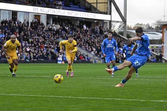 Harry Leonard scores from the penalty spot for Posh against Wimbledon. Photo David Lowndes.