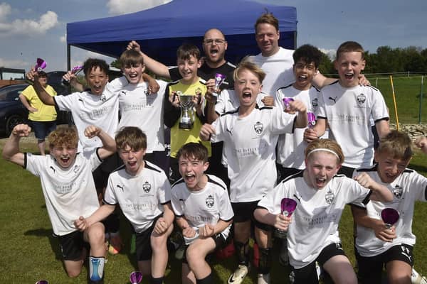 RTC celebrate their Under 12 League Cup Final success. Photo David Lowndes.