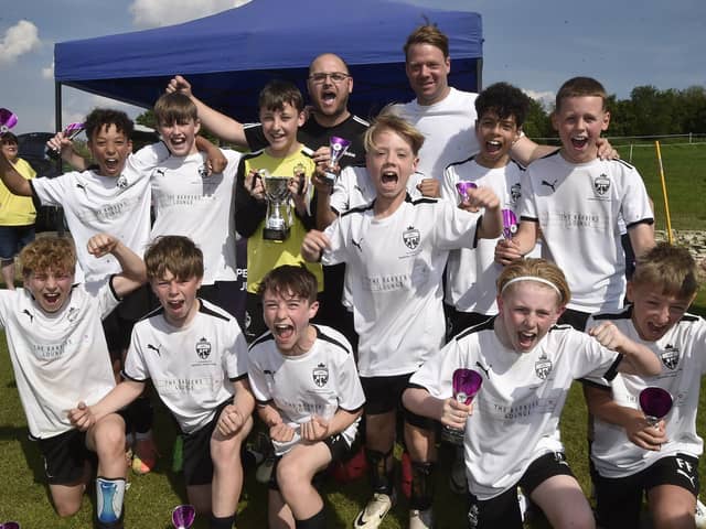 RTC celebrate their Under 12 League Cup Final success. Photo David Lowndes.