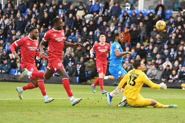 Ricky-Jade Jones is thwarted by Shrewsbury goalkeeper Harry Burgoyne. Photo: David Lowndes.