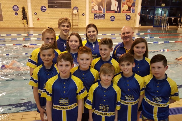 Youngsters from Mansfield Swimming Club pose for a picture in team colours.