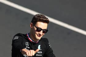 MELBOURNE, AUSTRALIA - APRIL 10: George Russell of Great Britain and Mercedes waves to the crowd on the drivers parade ahead of the F1 Grand Prix of Australia at Melbourne Grand Prix Circuit on April 10, 2022 in Melbourne, Australia.
