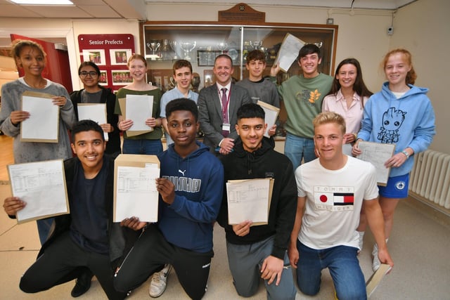 John Harrison, the new head teacher at the King's School with some of his successful GCSE students.