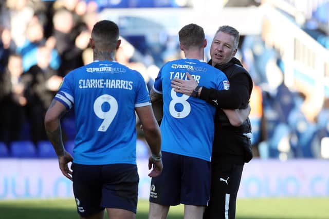 Peterborough United Manager Darren Ferguson congratulates his players after Saturday's win over Derby. Photo: Joe Dent/theposh.com.