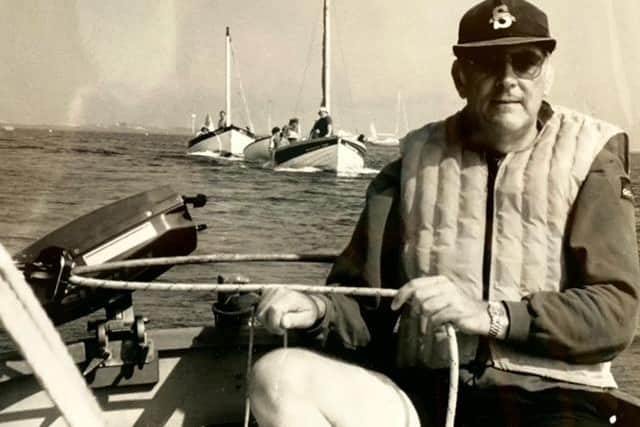 Richard Winfrey at the helm of his sailing dinghy.