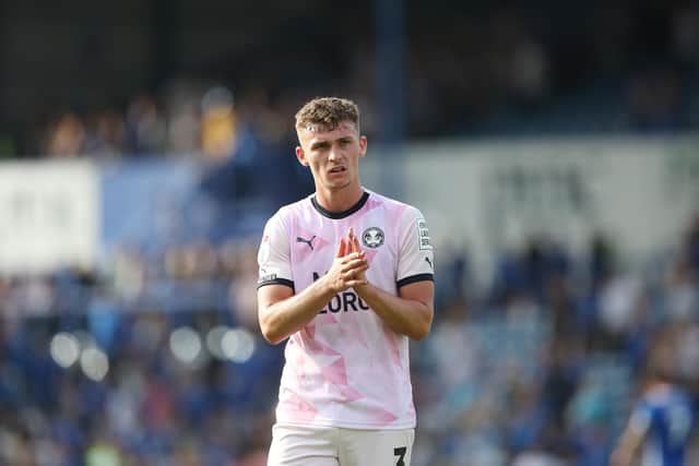Harrison Burrows applauds the Peterborough United fans at full-time. Photo: Joe Dent.