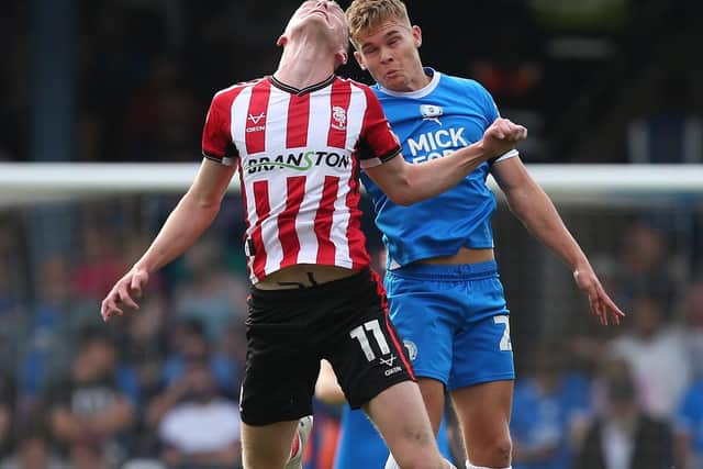 Archie Collins of Peterborough United in action against Lincoln City. Photo: Joe Dent/theposh.com