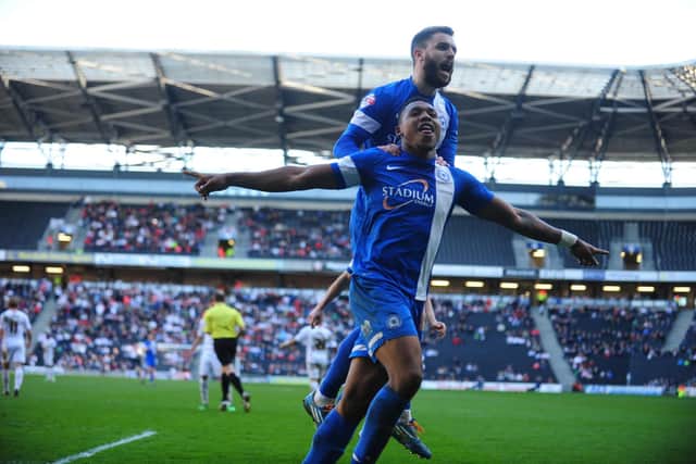 Britt Assombalonga celebrates a goal for Posh at stadium:mk in 2014. Photo: Alan Storer.