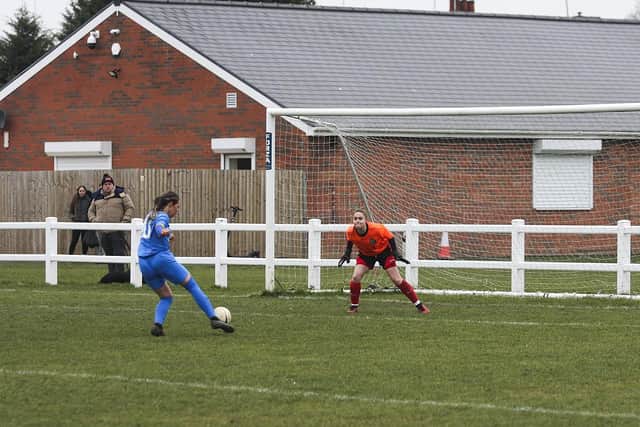​Katie Steward scores for Sports v Huntingdon. Photo: Tim Symonds.