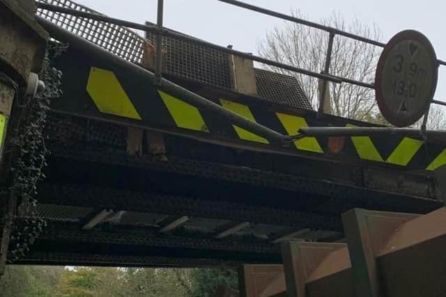 The damage caused after the bridge was hit by a lorry