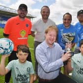 Organisers of a Sue Ryder charity football match at London Road - Matt Andrews, Ben Wilson, Vince Quarizzo and Jonny Ackroyd with MP Paul Bristow and Luca and Enzo Quarizzo.