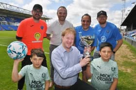 Organisers of a Sue Ryder charity football match at London Road - Matt Andrews, Ben Wilson, Vince Quarizzo and Jonny Ackroyd with MP Paul Bristow and Luca and Enzo Quarizzo.