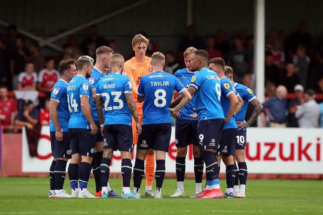 Peterborough United players huddle together before the second half when 2-0 down. Photo: Joe Dent/theposh.com