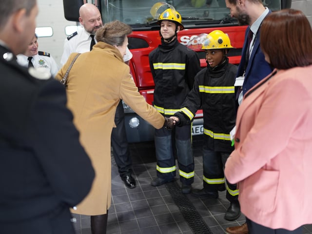 Benjamin Pekeja and Howard-Junior Miller-Ormsby (shaking hands) meet the Princess Royal