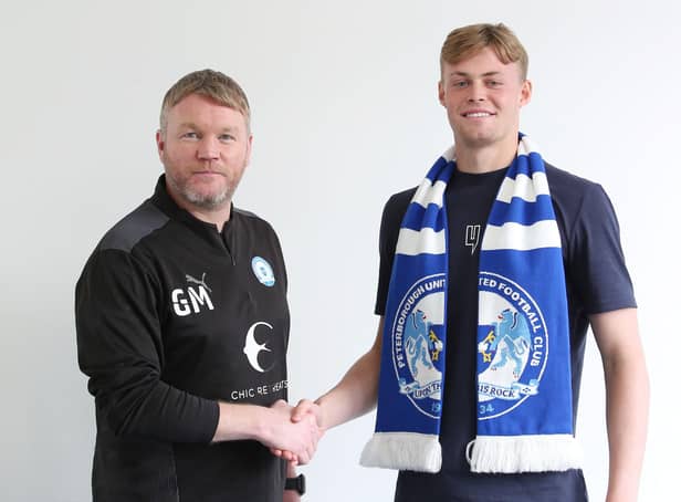 New Posh goalkeeper Harvey Cartwright (right) with manager Grant McCann.