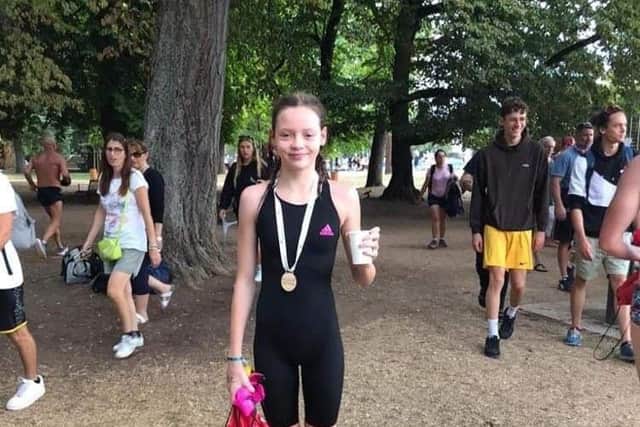 Emma Cushion with her medal in France.