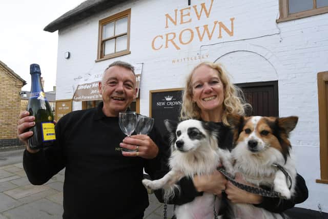 Jonathan and Louise Weston with their dogs, Chewy and Yoda. The couple are the new licensees at The New Crown pub, Long Causeway, Whittlesey.