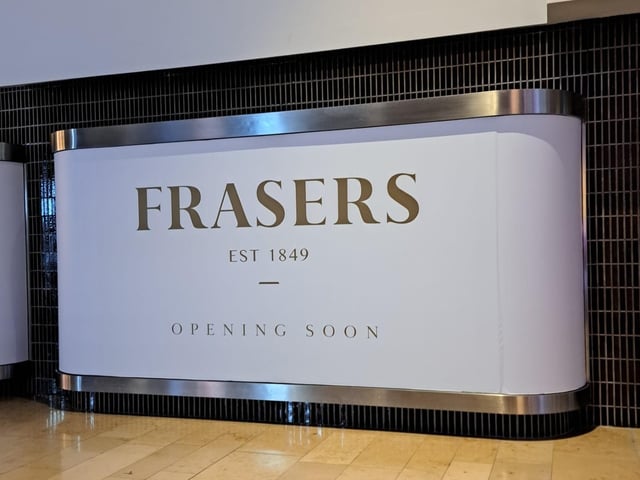 New signage at Peterborough's Queensgate Shopping Centre shows that retail giant Frasers is on its way to the city.