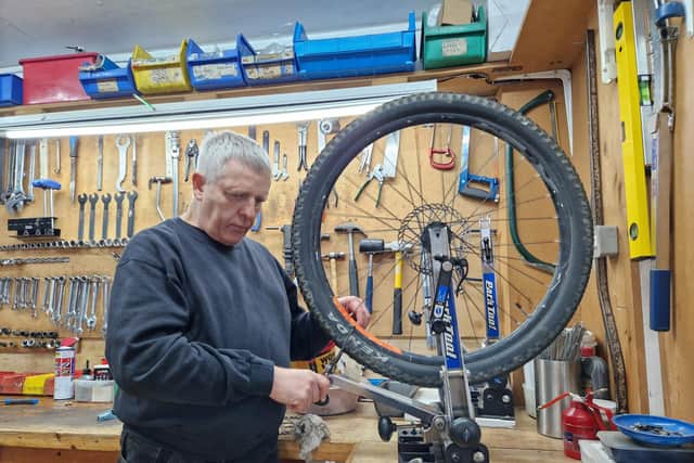 Though he is deaf-blind, Graham Hicks can remove and repair a bike wheel in less time than it takes to boil a kettle.