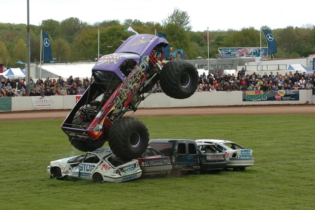 Monster truck, Slingshot, does what it does best in the main arena at Truckfest 2010.