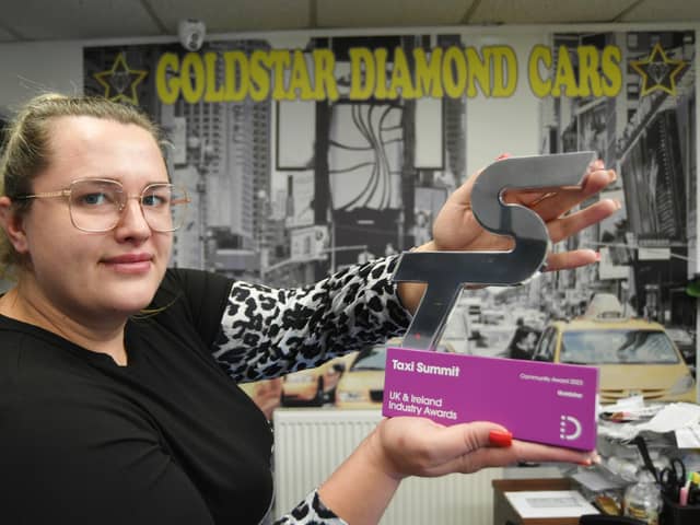 Andzela Smirenenko, accounts manager for Goldstar Diamond Cars, with their community award from Taxi Summit Awards