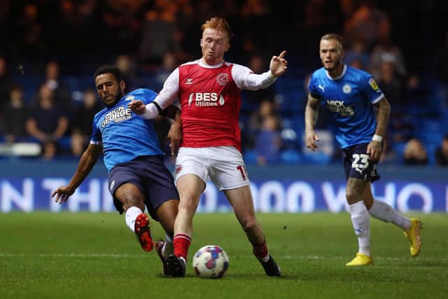 Nathan Thompson of Peterborough United tackles Callum Morton of Fleetwood Town. Photo: Joe Dent/theposh.com.