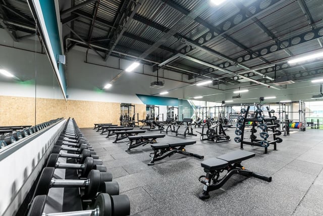 The gym includes a full functional zone, free weights area, fixed resistance and cardio equipment.