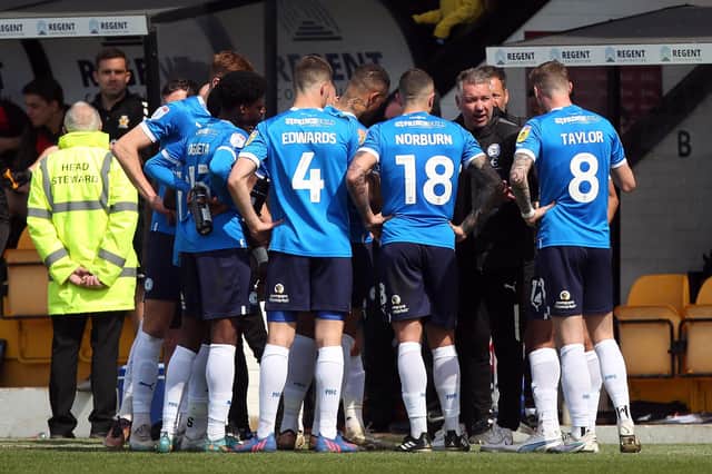 Peterborough United Manager Darren Ferguson talks to his players during a break in play. Photo: Joe Dent.