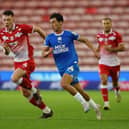 Joel Randall of Peterborough United in action with Kacper Lopata of Barnsley in August. Photo: Joe Dent/theposh.com