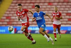 Joel Randall of Peterborough United in action with Kacper Lopata of Barnsley in August. Photo: Joe Dent/theposh.com