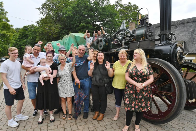 The traction engine returns to the village after 69 years away and pictured with members of the Gibbons family including Peter who originally drove the engine