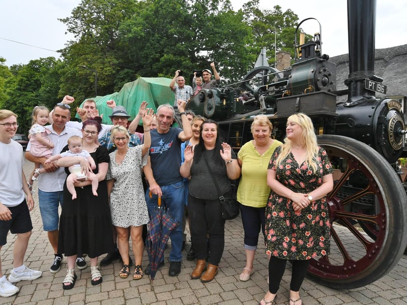 The traction engine returns to the village after 69 years away and pictured with members of the Gibbons family including Peter who originally drove the engine
