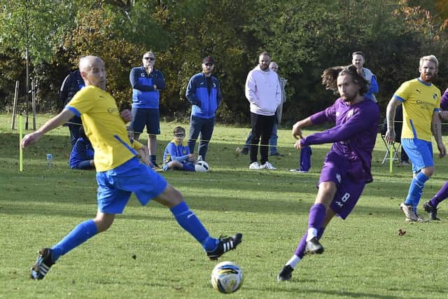 Action from Peterborough City (yellow) v Sawtry at Ringwood. Photo: David Lowndes.