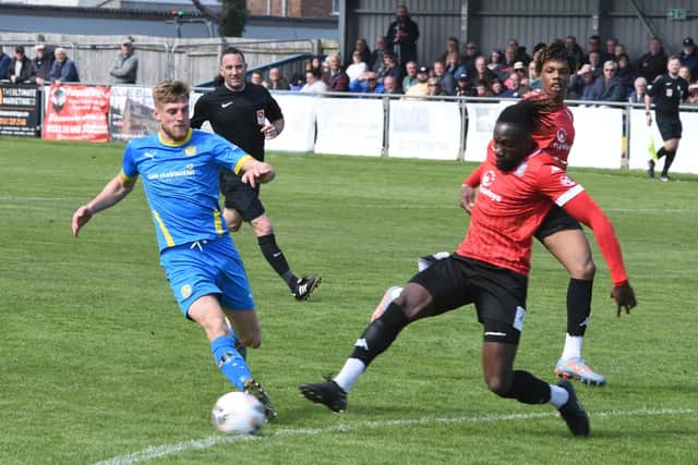 Connor Kennedy (blue) in action for Peterborough Sports against Hereford. Photo: David Lowndes.