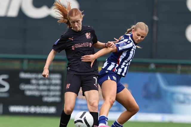 Lauren Wilshaw (left) in action for Posh Women at West Bromwich Albion. Photo Darren Wiles.