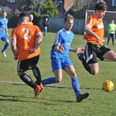 Action from a Thorney (orange) match in 2019.