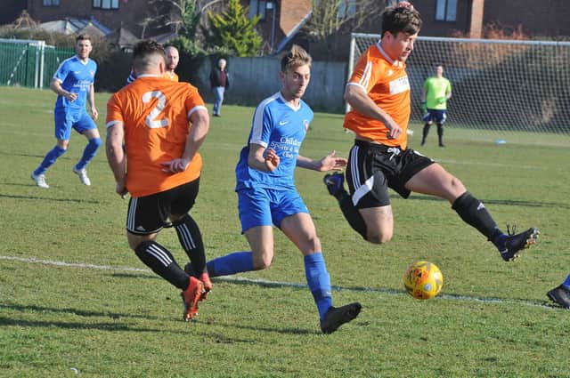 Action from a Thorney (orange) match in 2019.