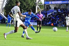 Liam Kelly shoots for goal against Burton Albion. Photo: David Lowndes.