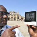 Ernest Mensah-Sekyere with a digital thermometer reading 40 degrees in direct sunlight at Cathedral Square in 2022.




NY22
