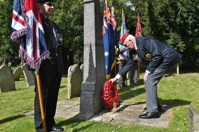 Roy Warden from the Royal Military Police laying a wreath