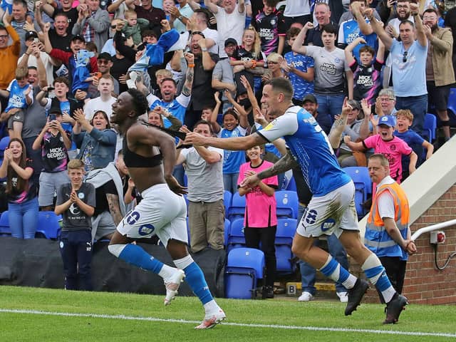Siriki Dembele celebrates his late winning goal for Posh against Derby in August.