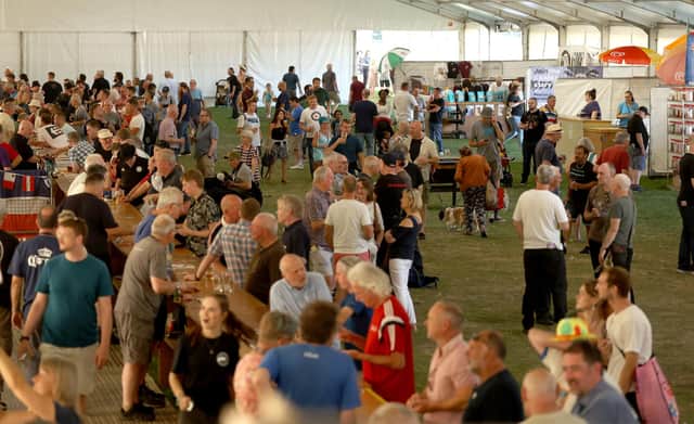 Customers enjoy the tastes of the Peterborough Beer Festival