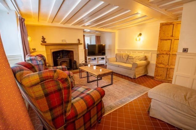 The property features many period features including exposed beams and stone work