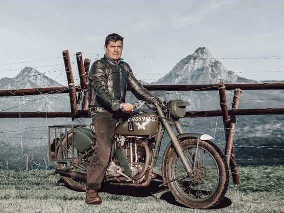 Terry Jones, who came up with the idea for the fundraiser, sitting astride his "dream bike" - a Second World War-era Matchless G3L WD (image: Dr David Roberts)