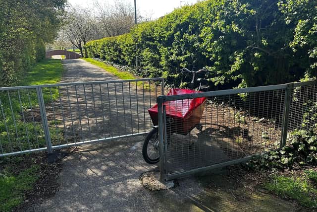 The barriers on the path make it difficult for cyclists, wheelchair users and others to pass