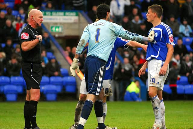 Ryan Bennett (right) is about to be sent off by referee Nigel Miller in the Posh v Derby clash in 2010. Photo: Ben Davis.