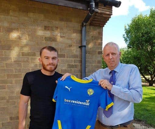 New Peterborough Sports signing Nathan Fox (left) with club chairman Grant Biddle.