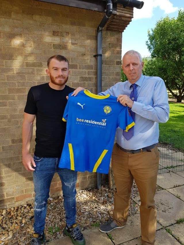 New Peterborough Sports signing Nathan Fox (left) with club chairman Grant Biddle.