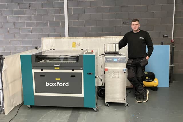 Tyson Wilson, production manager at Signs Express, in Fengate, Peterborough, with some of the new equipment.